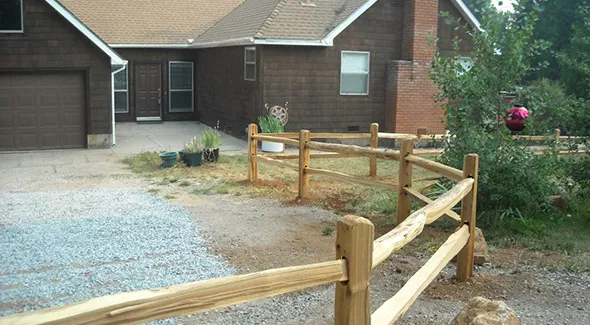 A new fence is being erected around a home, contributing to the property's security and visual charm.