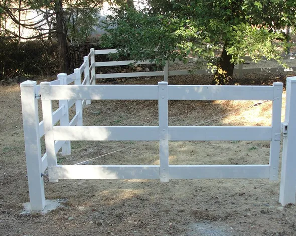 A white fence with a central gate enhances the yard, showcasing an effective fencing solution for property boundaries.